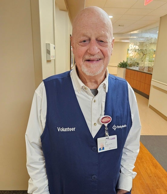 Schirmer wearing volunteer vest at hospital